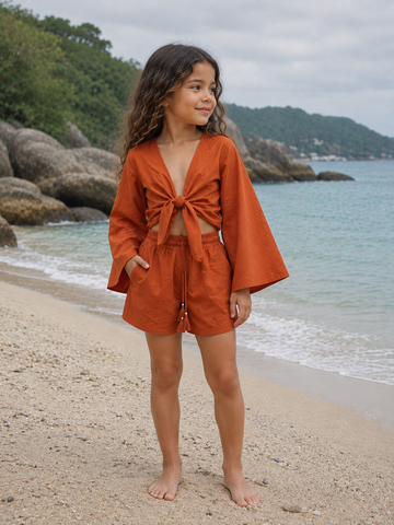 Girl’s Rust Orange Solid Cotton Beach Wear Set with Bell Sleeve Tie-Up Top & Tassel Shorts