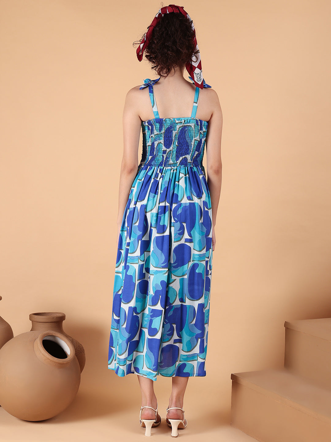 Aawari Blue Abstract Printed Rayon Bobbin Gown with Tie-Up Straps for Women - Western wear