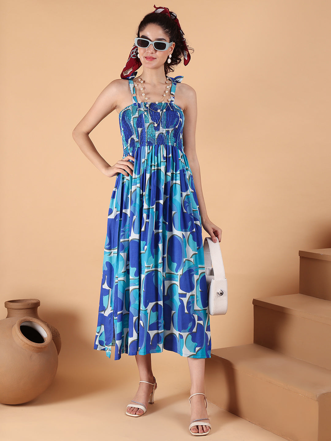 Aawari Blue Abstract Printed Rayon Bobbin Gown with Tie-Up Straps for Women - Western wear