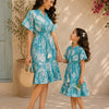 Mom & Daughter Aqua Bloom Printed Matching Smocked Waist Flared Dress Set with Tassel Tie-Up Detail