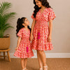 Mom & Daughter Sunset Bloom Printed Matching Smocked Waist Flared Dress Set with Tassel Tie Detail