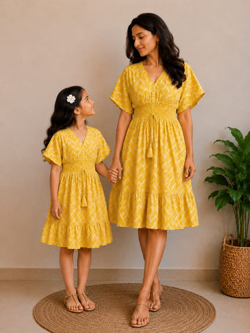 Mom & Daughter Sunshine Yellow Printed Matching Smocked Waist Flared Dress Set with Tassel Tie-Up Detail