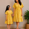 Mom & Daughter Sunshine Yellow Printed Matching Smocked Waist Flared Dress Set with Tassel Tie-Up Detail