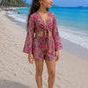 Girl’s Pink Multicolor Floral Printed Cotton Beach Wear Set with Bell Sleeve Tie-Up Top & Tassel Shorts