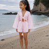 Girl’s Baby Pink Solid Cotton Beach Wear Set with Bell Sleeve Tie-Up Top & Tassel Shorts