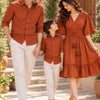 Rust Orange Family Twinning Outfit Set – Men’s and boy’s rust orange casual shirts paired with matching women’s rust orange V-neck flared dress featuring a smocked waist, flutter sleeves, and double tassel details.