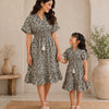 Mom & Daughter Monochrome Geometric Printed Matching Smocked Waist Flared Dress Set with Tassel Tie-Up Detail
