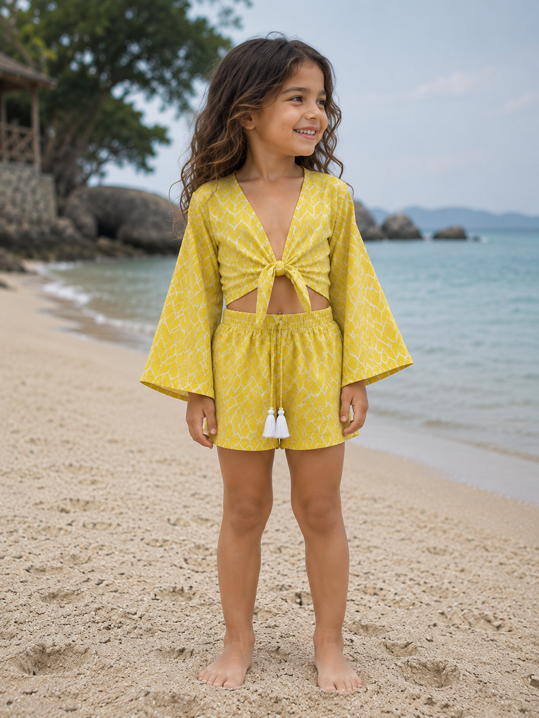 Girl’s Yellow Geometric Printed Cotton Beach Wear Set with Bell Sleeve Tie-Up Top & Tassel Shorts